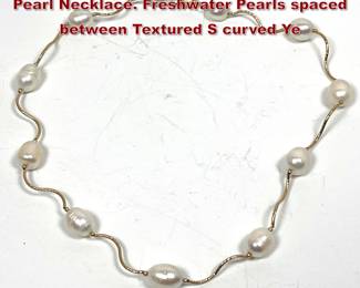 Lot 2134 14K Gold Station style Baroque Pearl Necklace. Freshwater Pearls spaced between Textured S curved Ye