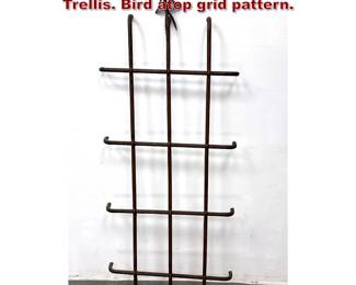 Lot 1826 Antique Forged Iron Window Grate Trellis. Bird atop grid pattern.