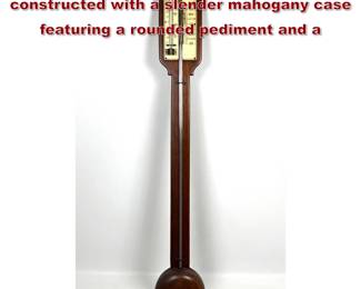 Lot 1900 Antique Stick barometer constructed with a slender mahogany case featuring a rounded pediment and a