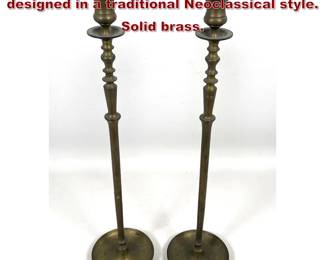 Lot 1722 Pair of tall brass candlesticks designed in a traditional Neoclassical style. Solid brass.