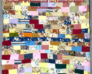 Lot 1738 Vintage patchwork tied quilt features a staggered rectangular block. Machine made.