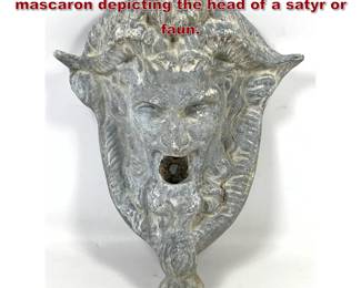 Lot 1937 Cast lead wall fountain mask or mascaron depicting the head of a satyr or faun.