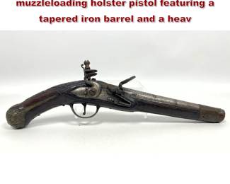 Lot 2181 Largebore antique flintlock muzzleloading holster pistol featuring a tapered iron barrel and a heav