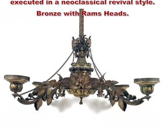 Lot 1709 Ornate four arm chandelier executed in a neoclassical revival style. Bronze with Rams Heads.