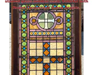 Lot 1831 Antique American leaded and stained glass window sash. Colorful with Round Opalescent Green Jewels.