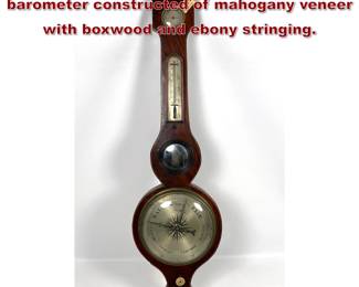 Lot 1896 Antique banjostyle wheel barometer constructed of mahogany veneer with boxwood and ebony stringing.