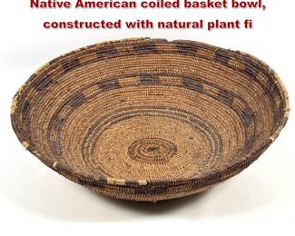 Lot 2002 Large and shallow Southwestern Native American coiled basket bowl, constructed with natural plant fi