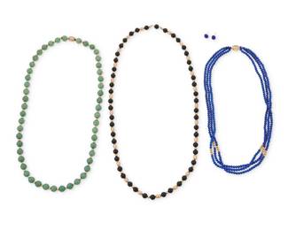 1073 A Group of 14K Gold and Hardstone Jewelry Including a lapis lazuli and gold bead necklace, a jade and gold bead necklace and an onyx and gold bed necklace together with a pair of oval lapis lazuli cabochon earrings 5 pieces Necklaces: 32 in., 20 in., and 28 in., Earrings: 3/8 in. 152.3 grams gross Estimate: $800 - $1,000
