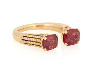 1088 An 18K Gold, Spinel and Diamond Ring Featuring two cushion-cut spinels weighing approximately 2.18 carats total, accented by round diamonds Size: 7 6.3 grams gross Estimate: $1,200 - $1,800