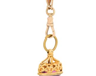 1130 A Gold Chain and Amethyst Fob Featuring a 10k gold long fancy link chain, suspending a brass jump ring with a 14k gold and amethyst fob Chain: 64 in., Fob: 7/8 x 7/8 in. 44.2 grams gross This lot is being offered with no reserve Estimate: $2,200 - $2,800