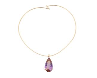 1127 A 14K Gold and Ametrine Pendant Necklace Featuring an omega chain suspending a pear-shaped ametrine weighing approximately 31.08 carats Chain: 18 in., Pendant: 1 3/4 in. 17.4 grams gross Estimate: $800 - $1,200