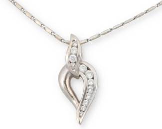 1042 A 14K White Gold and Diamond Pendant Necklace Featuring a looped design accented by graduated round diamonds weighing approximately 0.45 carat, suspended from a bar link chain Chain: 18 in., Pendant: 1 x 1/2 in. 8.4 grams gross This lot is being offered with no reserve Estimate: $600 - $800