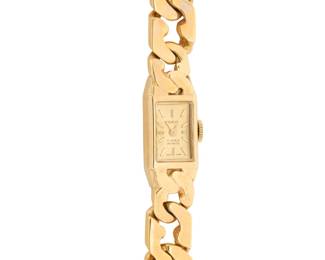 1162 Geneve: A 14K Gold Watch Dial: 7.5 mm, rectangular with baton hour markers Case: 10.80 mm Closure: gold Cuban link bracelet Signed: dial Inner circumference: 6 3/4 in. 41.6 grams gross Estimate: $2,000 - $3,000