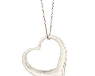 1176 Elsa Peretti for Tiffany & Co.: A Sterling Silver Heart Necklace The sterling silver sculptural shaped open-heart pendant suspended on a fine sterling silver chain, each marked for artist and for sterling Pendant: 1 1/4 in. x 1 3/8 in.; chain: 29 in. 15.7 grams This lot is being offered with no reserve Estimate: $500 - $700