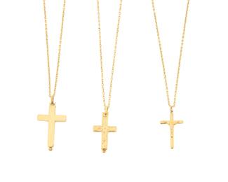 1081 A Group of Three 21K Gold Cross Necklaces Including three cross pendant necklaces suspending from oval link chains 3 pieces Chain: 18 in.,19 in. and 20 in., Pendants: 1 in., 1 1/8 in. and 1 1/4 in. 24.3 grams gross Estimate: $2,500 - $3,500