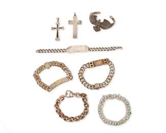 1185 A Group of Sterling Silver Jewelry Comprising three chunky sterling silver ID bracelets, two with 10K gold monogram letters and one with personal engravings and dedication, two sterling silver link bracelets, including a Napier bracelet with oval links and a small charm bracelet, as well as a sterling silver eagle cuff bracelet, and two sterling silver cross pendants, one with black inlay 8 pieces Bracelets: 8 3/4 in. to 7 1/2 in. L; cuff: 6 3/4 in. inner C x 1 5/8 in. H; pendants: 2 3/4 in. to 2 1/2 in. H 332.5 grams gross This lot is being offered with no reserve Estimate: $500 - $700