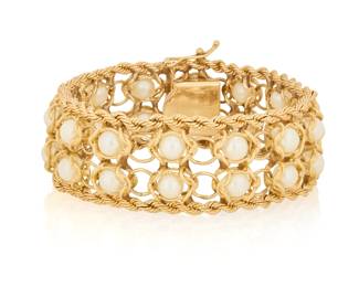 1020 A 14K Gold and Cultured Pearl Bracelet Featuring two rows of cultured pearls set in fancy interlocking links, finished with two bands of rope gold Length: 7 3/4 in., Width: 1 in. 52.0 grams gross Estimate: $2,500 - $3,500