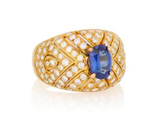 1005 An 18K Gold, Sapphire and Diamond Ring Centering an oval sapphire weighing approximately 1.47 carats, set in a domed design accented by round diamonds Size: 8 1/2 11.96 grams gross Estimate: $2,000 - $2,500