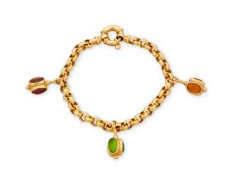 1009 A 14K Gold and Gem-Set Bracelet Of an open link design suspending three charms set with oval amethyst, citrine and peridot, signed Italy with Italian workshop marks Length: 7 1/2 in. 17.0 grams gross Estimate: $700 - $900
