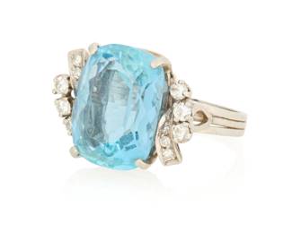 1051 A Platinum, Aquamarine and Diamond Ring Centering a rectangular cushion-cut aquamarine weighing approximately 8.79 carats, accented by round diamonds weighing approximately 0.36 carat Size: 5 6.9 grams gross Estimate: $1,000 - $1,500