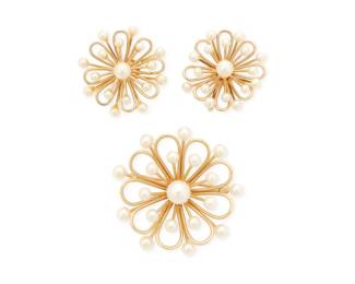 1019 A 14K Gold and Cultured Pearl Brooch and Earring Set Including a brooch and pair of earrings all of a floral openwork design accented by cultured pearls, with maker's marks 3 pieces Brooch: 1 1/2 in., Earrings: 1 in. 16.7 grams gross Estimate: $700 - $900