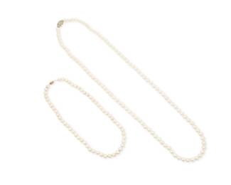 1146 A Group 14K Gold and Two Cultured Pearl Necklaces Both of a single strand design featuring cultured pearls measuring approximately 7.40 - 8.30 mm, finished with gold clasps 2 pieces Lengths: 35.0 in., and 18 in. 120.5 grams gross This lot is being offered with no reserve Estimate: $500 - $700