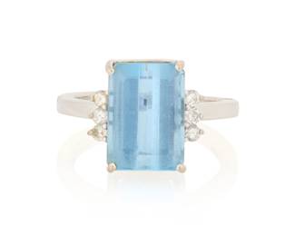 1058 A 14K White Gold, Aquamarine and Diamond Ring Centering a rectangular mixed-cut aquamarine weighing approximately 4.15 carats, accented by six round diamonds Size: 7 with hinged shank 5.2 grams gross Estimate: $1,000 - $1,500