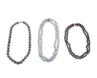 1055 A Group of Three Colored Cultured Pearl Necklaces Including a single strand of graduated Tahitian pearls, a double strand of blackish purple pearls and a two-strand baroque blue pearl necklace 3 pieces Lengths: 18 in., 15 in., and 18 in. 219.5 grams gross This lot is being offered with no reserve Estimate: $700 - $900