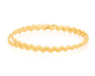 1078 A Pair of 22K Gold Bangles Of a textured waving design 2 pieces Inner circumference: 7 3/4 in. 22.5 grams gross Estimate: $2,200 - $2,800