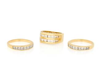 1093 A Group of Three 14K Gold and Diamond Rings Featuring round and princess-cut diamonds weighing approximately 3.50 carats Sizes: 7 and 9 1/2 27.8 grams gross Estimate: $1,500 - $2,000
