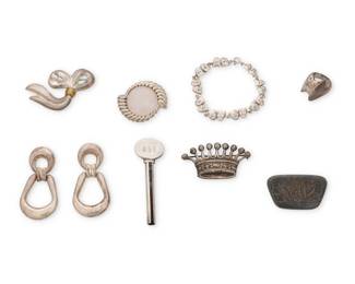 1198 A Group of Silver Jewelry including Georg Jensen & Tiffany & Co. Eight works comprising a Georg Jensen Denmark sterling silver modernist ring (No. 140) and a Tiffany & Co. sterling silver tubular key with monogram, as well as four silver brooches, including a 1950 GÄ Strickland Swedish silver lily-of-the valley pin, and a Mexican silver and mixed metal bow pin, a pair of sterling silver modernist earrings, and a narrow link silver bracelet with diminutive comedy/tragedy theater mask links, each marked for sterling, and three for country 9 pieces Ring: size 7; Key: 2 7/8 in.; Brooches: 2 1/4 in. to 1 1/2 in.; earrings: 2 3/8 in.; bracelet: 7 in. L 114.10 grams gross This lot is being offered with no reserve Estimate: $500 - $700