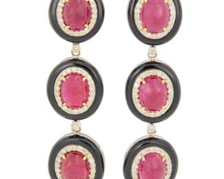 1089 A 14K Gold, Silver, Onyx, Diamond and Ruby Pair of Earrings Featuring size oval cabochon rubies weighing approximately 16.84 carats, encircled by round diamonds 1.45 carats, finished with oval onyx elements 2 pieces Measures: 2 x 1/2 in. 17.0 grams gross Estimate: $1,200 - $1,800