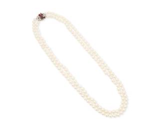 1143 A White Gold, Cultured Pearl and Ruby Necklace Featuring two nested strands of cultured pearls measuring approximately 7.50 mm, finished with a 12k white gold, pear-shaped ruby and round diamond clasp Length: 25 - 26 in. 114.5 grams gross Estimate: $600 - $800