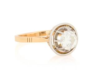 1040 An 18K Gold, Platinum and Diamond Ring Centering an old European-cut diamond weighing 1.00 carat Size: 7 1/2 4.4 grams gross Estimate: $700 - $900