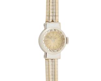 1165 Girard Perregaux: An 18K White Gold Watch Dial: 11.20 mm round with baton hour markers Case: 16.50 mm Case number: 79690129 Closure: white gold bracelet with notched clasp Signed: dial and clasp Inner circumference: 6 1/4 - 6 1/2 in. 24.5 grams gross Estimate: $1,000 - $1,500