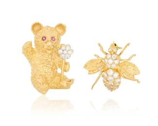 1147 Two 18K Gold Animal Brooches Including a bear holding a flower set with round diamonds and two rubies, together with a bee accented by round diamonds weighing approximately 0.75 carats 2 pieces Measures: 1 1/8 in. and 3/4 in. 16.7 grams gross Estimate: $1,000 - $1,500
