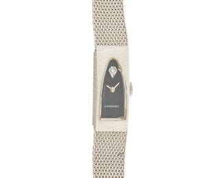 1166 Longines: A 14K White Gold and Metal Watch Dial: 8.50 mm, 14k white gold arched with no hour markers Case: 10.50 mm Closure: metal band with gold filled clasp Signed: dial Inner circumference:7 1/4 in. 24.7 grams gross This lot is being offered with no reserve Estimate: $400 - $600