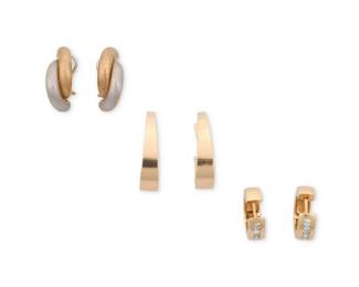 1097 A Group of Three Pairs of 14K Gold Earrings Including a pair featuring bi-color gold and satin finish, a pair of graduated half oval hoop earrings and a pair of smaller round hoop earrings 6 pieces Measures: 5/8 - 1 in. 15.4 grams gross Estimate: $600 - $800
