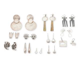 1186 A Group of Silver Earrings Mid/late 20th century Most variously marked for maker and/or for sterling Comprising twelve pairs of silver and mixed metal earrings in various styles including modernist and Southwest 24 pieces 3 1/4 in. H x 2 1/8 in. W to 1 1/8 in. H x 3/8 in. W 144.1 grams gross This lot is being offered with no reserve Estimate: $200 - $400