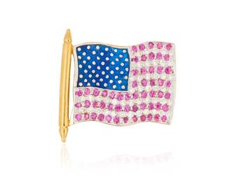 1001 An 18K Gold, Diamond and Ruby Flag Pin Of an American flag design featuring blue enamel accented by round rubies and round diamonds  Measures: 1 x 7/8 in. 3.6 grams gross  This lot is being offered with no reserve Estimate: $300 - $500