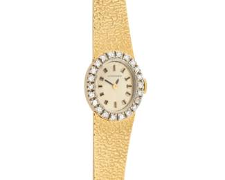 1163 Longines: A 14K Gold and Diamond Watch Dial: 11.92 mm, oval with baton hour markers, encircled by single-cut diamonds Case: 16.12 mm Closure: textured gold bracelet with notched clasp Signed: dial Inner circumference: 7 1/2 - 7 3/4 in. 37.2 grams gross Estimate: $1,800 - $2,500