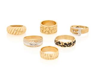 1112 A Group of Six 14K Gold Rings Featuring textured and floral design with one of a buckle motif accented by round diamonds Sizes: 7 1/2 - 10 3/4 46.0 grams gross Estimate: $2,800 - $3,500