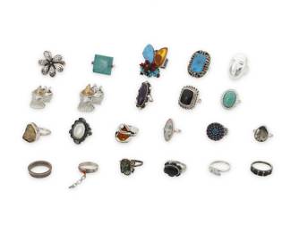 1187 A Group of Silver and Set Stone Rings Mid/late 20th century Most variously marked for maker and/or for sterling Comprising twenty two set stone and silver rings in various styles including classic, modernist, floral, and Southwest, featuring various stones including turquoise, amethyst, opal, mother of pearl, hematite, coral, and green hardstone 22 pieces Ring sizes: 9 to 5 188.4 grams gross This lot is being offered with no reserve Estimate: $200 - $400
