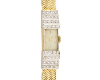 1164 A 14K Gold and Diamond Watch Dial: 9.20 mm, rectangular with Diver hour markers, accented by four rows of round diamonds weighing approximately 0.96 carat Case: 10.20 mm Closure: woven gold bracelet with notched clasp Signed: clasp marked ST.GEO Inner circumference: 7 - 7 1/2 in. 27.5 grams gross Estimate: $1,500 - $2,500