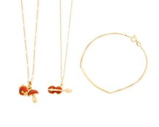 1155 A Group of 18K Gold and Enamel Jewelry Including a necklace suspending a red enamel violin charm, a necklace suspending a red enamel mushroom and fish charm, together with a box chain bracelet 3 pieces Bracelet: 7 in., Chains: 17 in. 13.3 grams gross Estimate: $1,200 - $1,800