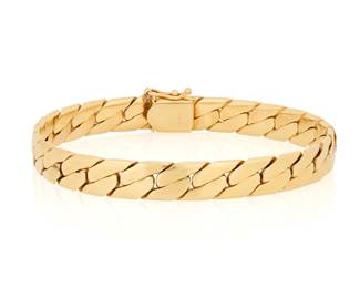 1153 A 14K Gold Bangle Bracelet Of a Cuban link design Length: 8 3/8 in., Width: 3/8 in. 39.0 grams gross Estimate: $2,500 - $3,500