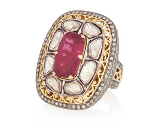 1090 A Gold, Pink Tourmaline and Diamond Ring Centering a rectangular cushion-cut pink tourmaline measuring approximately 16.70 x 10.40 mm, accented by round and sliced diamonds all set in a mogul style mount Size: 8 1/4 25.7 grams gross Estimate: $2,000 - $3,000