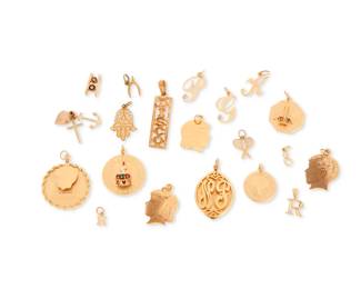 1030 A Group of Gold Charms Including a disco name plate, silhouettes, initials and birthday charms 20 pieces Measures: 3/8 - 1 1/2 in. 50.0 grams gross Estimate: $3,000 - $5,000