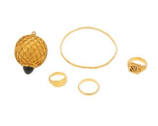 1079 A Group of 22K Gold Jewelry Including three rings, one bangle and one charm featuring a large blue glass cabochon 5 pieces Rings: 4 1/2, 7 and 7 3/4, Bangle: 6 1/2 in., Charm: 1 1/2 in. 45.5 grams gross Estimate: $4,200 - $4,800