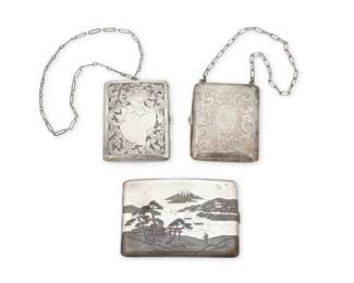 1184 A Group of Chased Silver Boxes/Compacts Early/mid-20th century Comprising three silver hinged boxes, including a large box with a Japanese landscape design in chased sterling silver and copper inlay with kanji characters verso, and with interior expandable band as well as two chased sterling silver compacts or reticule boxes, each with elaborate arabesque designs, and each with smooth leather coin or card inserts to interior, and a paperclip chain handle, each marked for sterling, one marked for Eastwood-Park Co. 3 pieces Largest: 3 1/8 in. x 4 1/4 in. x 3/8 in.; smallest: 2 3/4 in. x 3 1/2 in. x 1/2 in. 273.1 grams gross This lot is being offered with no reserve Estimate: $200 - $400